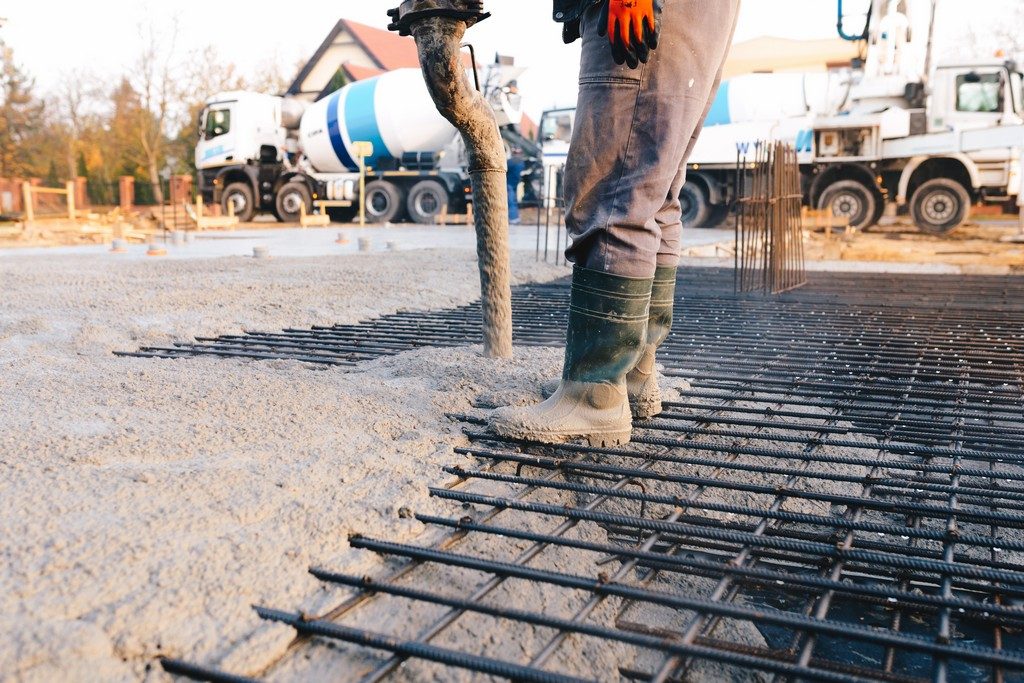 Concrete worker laying a foundation for a business in Porirua